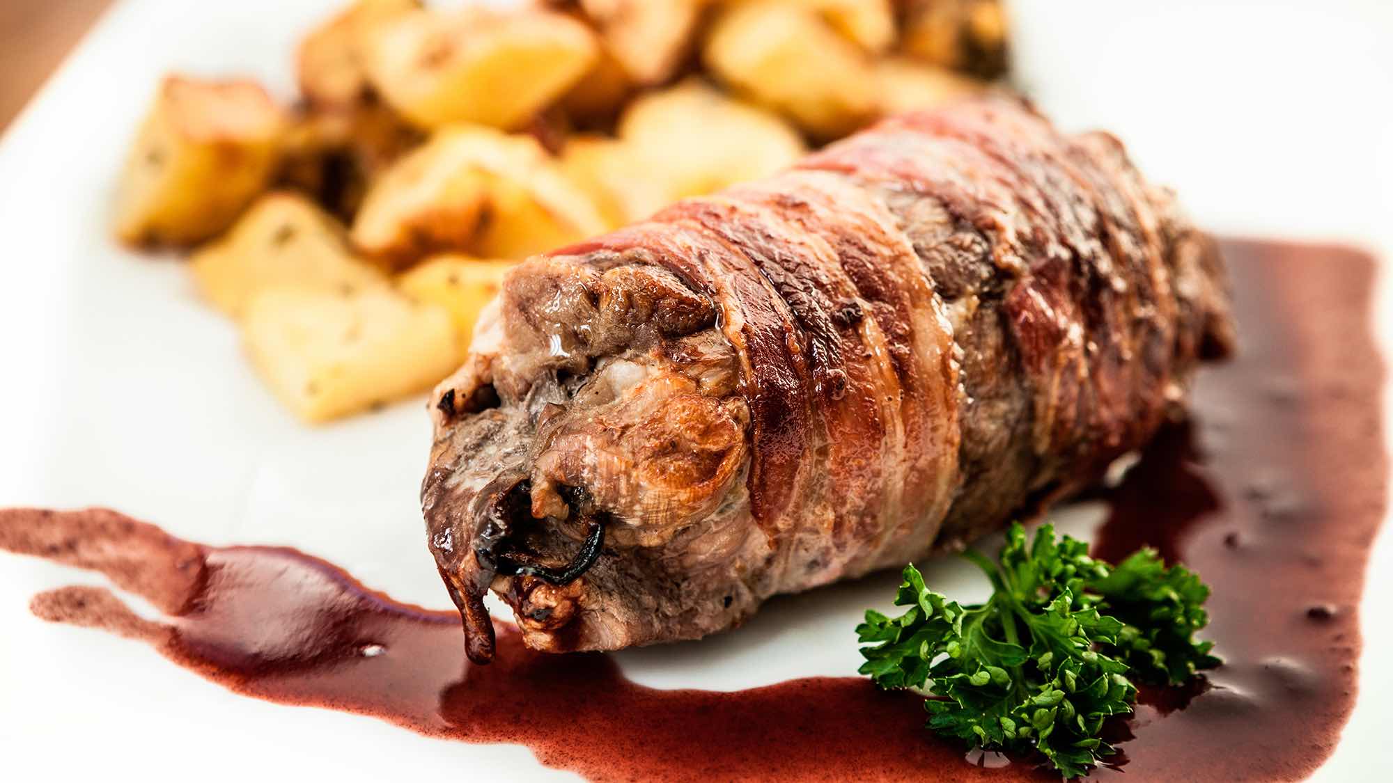Beef Wrapped in Pancetta and Chicken Stuffing with Cinnamon Carrots