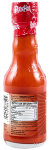 The back of a glass bottle of Franks Rdhot Orig Gb 24/148 Ml displays the nutritional information, ingredients, and brand story.