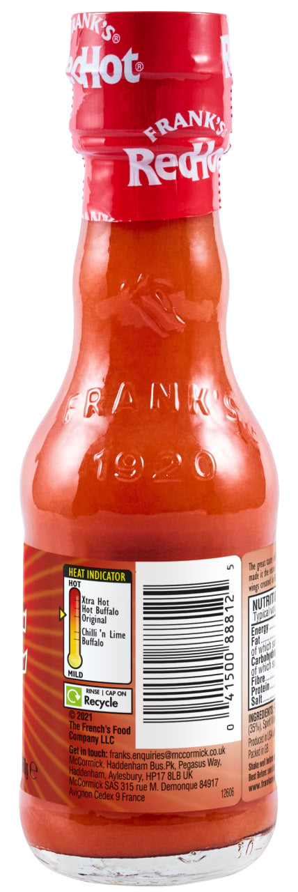The back of a glass bottle of Franks Rdhot Orig Gb 24/148 Ml shows the label with a heat indicator, barcode, and nutritional information.