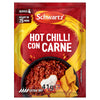 A red packet of Schwartz Hot Chilli Con Carne Recipe Mix 41G is shown in front of a delicious serving suggestion of the finished dish in a bowl with tortilla chips.