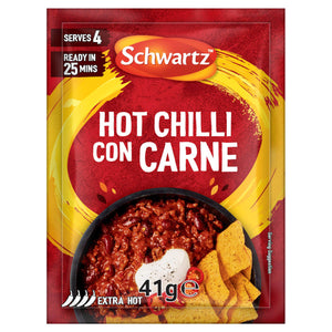 A red packet of Schwartz Hot Chilli Con Carne Recipe Mix 41G is shown in front of a delicious serving suggestion of the finished dish in a bowl with tortilla chips.