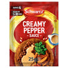 A red sachet of Schwartz Creamy Pepper Sauce Mix 25G is shown with a serving suggestion of the sauce poured over a grilled steak with potato wedges.