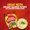 A packet of Schwartz Chicken Casserole Recipe Mix 36G is featured in an advertisement alongside a bowl of creamy mashed potatoes, illustrating a serving suggestion against a red textured background.