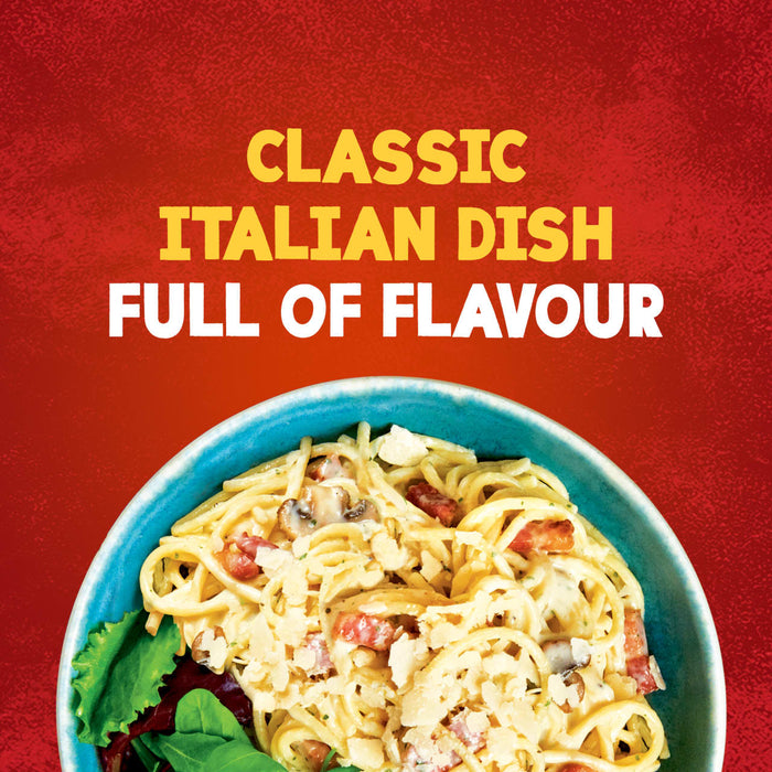 A close-up of a finished bowl of spaghetti carbonara, made using the Schwartz Spaghetti Carbonara Recipe Mix 32G, is shown against a red background with the text Classic Italian Dish Full of Flavour.
