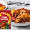 A packet of Schwartz Chicken Chasseur Recipe Mix 40G is displayed next to a plated serving of the finished dish featuring tender chicken pieces in a rich tomato and mushroom sauce with olives and capers.