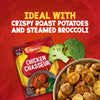 A packet of Schwartz Chicken Chasseur Recipe Mix 40G is displayed against a red background alongside fresh broccoli and a bowl of crispy roast potatoes as a serving suggestion.