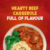 A delicious serving of hearty beef casserole, made possible with Schwartz Beef Casserole Recipe Mix 38G, is plated with mashed potatoes and broccoli.