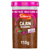 A clear plastic jar of Schwartz Cajun Seasoning 110G featuring a pink lid and a label with a Taste of Louisiana graphic and illustrations of chili peppers and herbs.