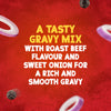 An advertisement for Schwartz Roast Beef Gravy Mix 27G shows text describing a tasty gravy mix with roast beef and sweet onion flavour, surrounded by floating onion slices and peppercorns on a red background.