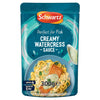 A 300g pouch of Schwartz Creamy Watercress Sauce For Fish featuring a serving suggestion of salmon and pasta drizzled with the green sauce.