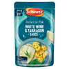 A 300g microwaveable pouch of Schwartz White Wine & Tarragon Sauce For Fish 300G featuring a serving suggestion of white fish and roasted potatoes on a blue plate.