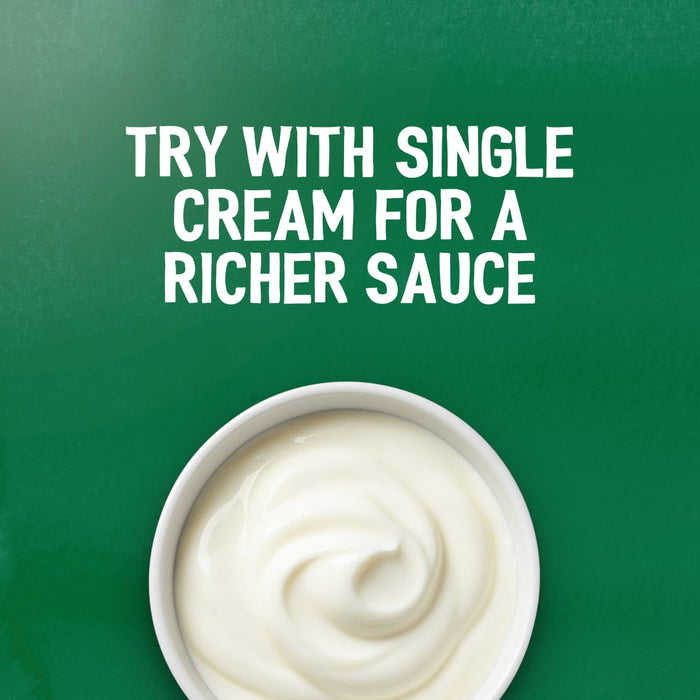 A serving suggestion for the Schwartz Bella Italia Pollo Funghi Creamy Chicken & Wild Mushroom Rigatoni 30G shows a bowl of single cream against a green background with text that reads, Try with single cream for a richer sauce.