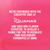 A promotional graphic for the Schwartz Las Iguanas Bahian Coconut Curry 25G features white text on a pink background, announcing a partnership with the executive chef at Las Iguanas to help you recreate restaurant favourites at home.