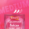 A close-up shot shows a packet of Schwartz Las Iguanas Bahian Coconut Curry 25G against a textured pink background with the word MEDIUM and three chili icons to indicate its spice level.
