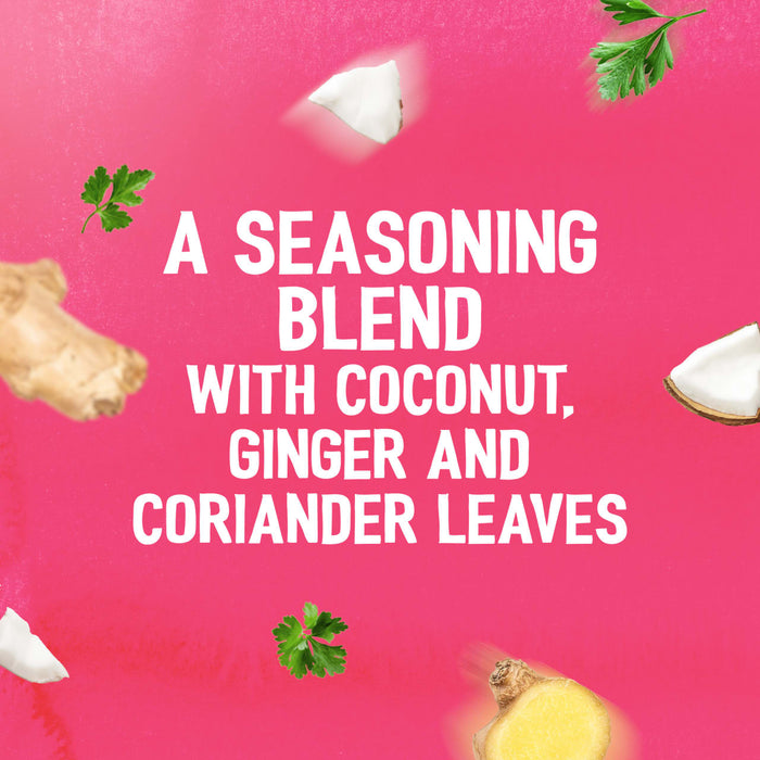 A vibrant pink background with floating ingredients like coconut, ginger, and coriander leaves highlights the flavor profile of the Schwartz Las Iguanas Bahian Coconut Curry 25G, described as a seasoning blend.