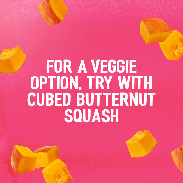 Cubed butternut squash floats on a pink background, illustrating a veggie serving suggestion for the Schwartz Las Iguanas Bahian Coconut Curry 25G.