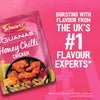 A promotional graphic for Schwartz Las Iguanas Honey Chilli Chicken 35G seasoning mix featuring a prepared dish of glazed chicken wings over fries and bold text identifying the brand as the UK number one flavour experts.