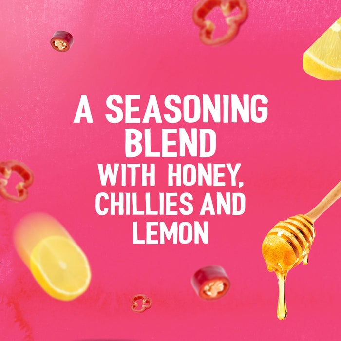 A vibrant pink graphic featuring floating ingredients like lemon slices, red chillies, and a honey dipper to describe the seasoning blend of Schwartz Las Iguanas Honey Chilli Chicken 35G.