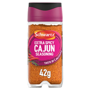 A clear glass jar of Schwartz Extra Spicy Cajun 42G Grill&Sizzl seasoning featuring a vibrant pink label with illustrations of red chili peppers and herbs.