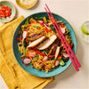 A vibrant bowl of stir fried noodles topped with sliced grilled chicken and fresh vegetables is perfectly seasoned with Schwartz Chinese 5 Spice Seasoning 58G.