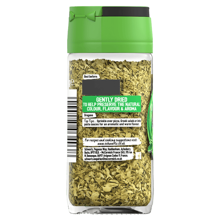 The back of a clear glass jar of Schwartz Oregano 7G, showing the dried herb and label with cooking suggestions and company information.