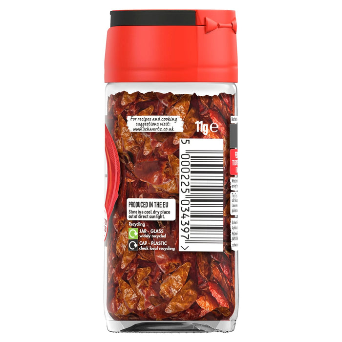A clear glass jar of Schwartz Birds Eye Chillies 11G showing the whole dried red peppers through the side label which includes recycling information and a barcode.