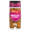 A clear glass jar of Schwartz Moroccan Seasoning 40G featuring a vibrant pink label with illustrations of cinnamon sticks and red peppers.