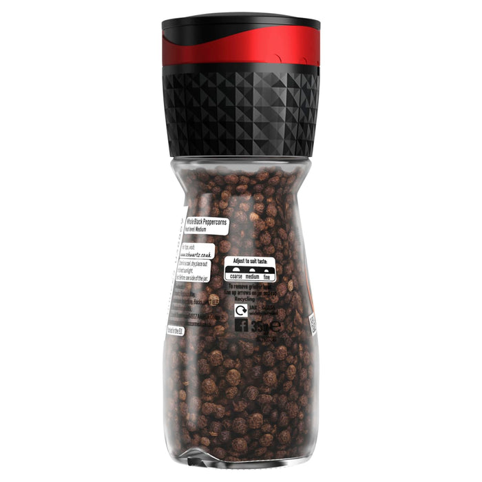A clear glass bottle of Schwartz Black Peppercorns Adjustable Medium Grinder 35G is shown against a white background, highlighting the whole peppercorns inside and the adjustable grinder top.