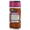 The back of a glass jar of Schwartz Paprika & Onion Chicken Seasoning 50G, showing the ingredients, usage tips, and company information on the label.