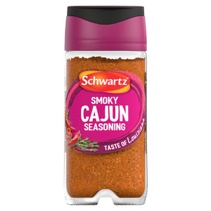 A clear glass jar of Schwartz Smoky Cajun Seasoning 45G featuring a vibrant pink label with illustrations of red chili peppers and fresh thyme.