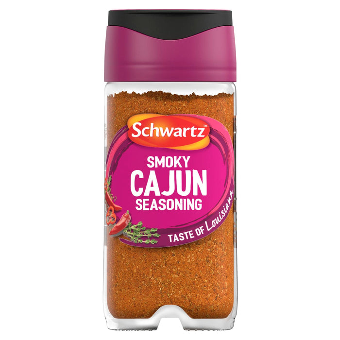 A clear glass jar of Schwartz Smoky Cajun Seasoning 45G featuring a vibrant pink label with illustrations of red chili peppers and fresh thyme.