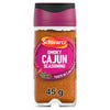 A clear glass jar of Schwartz Smoky Cajun Seasoning 45G featuring a vibrant pink label with illustrations of red chili peppers and thyme sprigs.