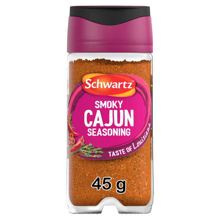 A clear glass jar of Schwartz Smoky Cajun Seasoning 45G featuring a vibrant pink label with illustrations of red chili peppers and thyme sprigs.