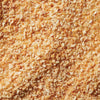 A close-up, top-down view shows the coarse, golden-brown texture of Schwartz Garlic Granules 50G.