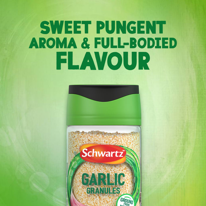 A clear jar of Schwartz Garlic Granules 50G is shown against a vibrant green background with text above reading Sweet pungent aroma & full-bodied flavour.