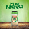 A bottle of Schwartz Garlic Granules 50G sits on a wooden table, with text above explaining that 1/4 teaspoon is equivalent to 1 fresh clove.