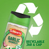 A jar of Schwartz Garlic Granules 50G is shown against a green background with a large recycling symbol to highlight its recyclable jar and cap.