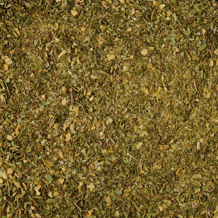 A detailed close up view shows the varied textures and earthy green tones of Schwartz Mixed Herbs 11G.
