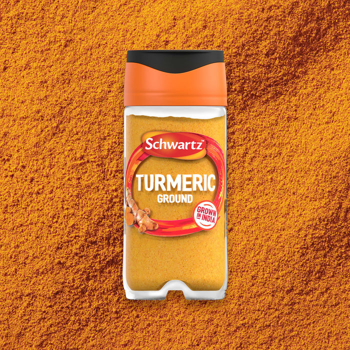 A clear jar of Schwartz Turmeric Ground 37G sits centered on a bed of the vibrant, golden-orange spice.