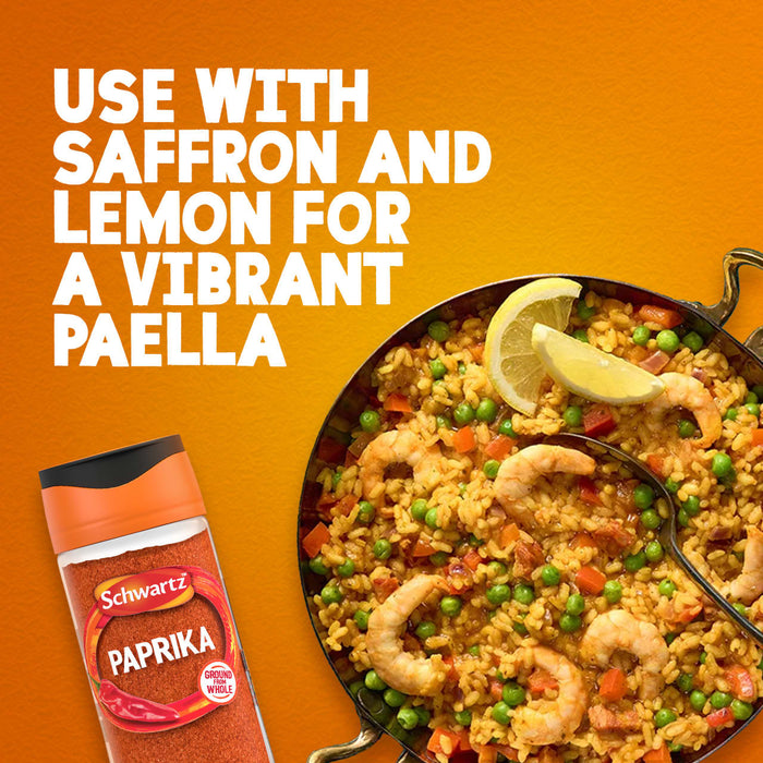 This advertisement image features a jar of Schwartz Paprika 40G next to a pan of vibrant shrimp paella, illustrating the suggestion to use it with saffron and lemon.