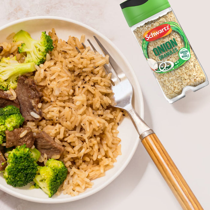 A delicious-looking bowl of beef, broccoli, and rice is shown next to a jar of Schwartz Onion Granules 30G, suggesting a key ingredient for the dish.