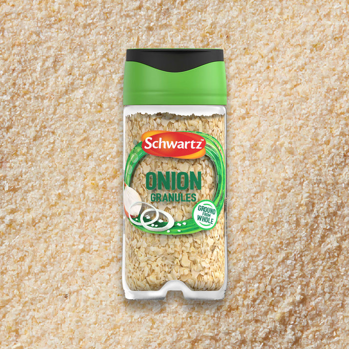 A clear jar of Schwartz Onion Granules 30G is centered on a background of the same onion granules.