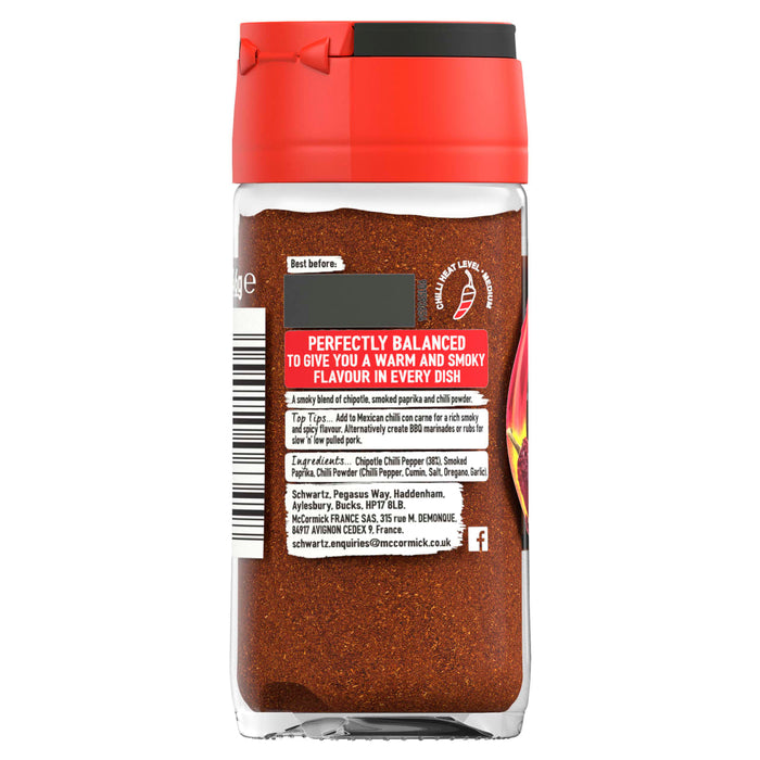 A back view of a glass jar of Schwartz Chipotle Chilli Powder 46G showing the ingredients list and a medium heat level indicator.