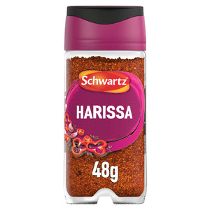 A clear glass jar of Schwartz Harissa 48G spice blend featuring a vibrant purple label with illustrations of red chili peppers and garlic.