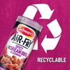 A promotional graphic featuring a container of Schwartz Af Sy Korean Seas positioned in front of a large white recycling symbol to highlight that the packaging is recyclable.