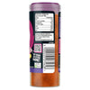 A clear plastic bottle of Sgk Uploads spice, featuring a purple lid, a black label with nutritional information, McCormick/Schwartz branding, a QR code, and a barcode, filled with reddish-orange spice powder.