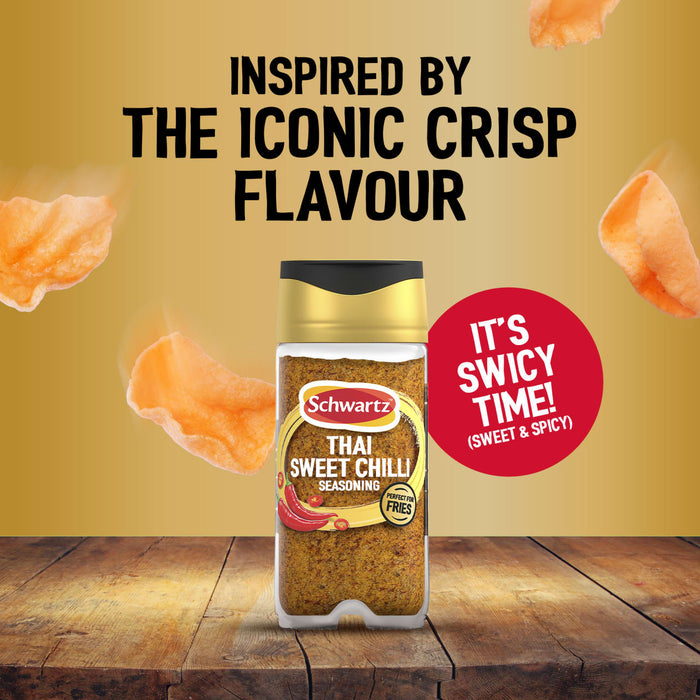 A bottle of Jr Thai Sweet Chil Seas X6 by Schwartz is displayed on a wooden surface against a gold background with floating crisps to highlight its sweet and spicy flavor profile.