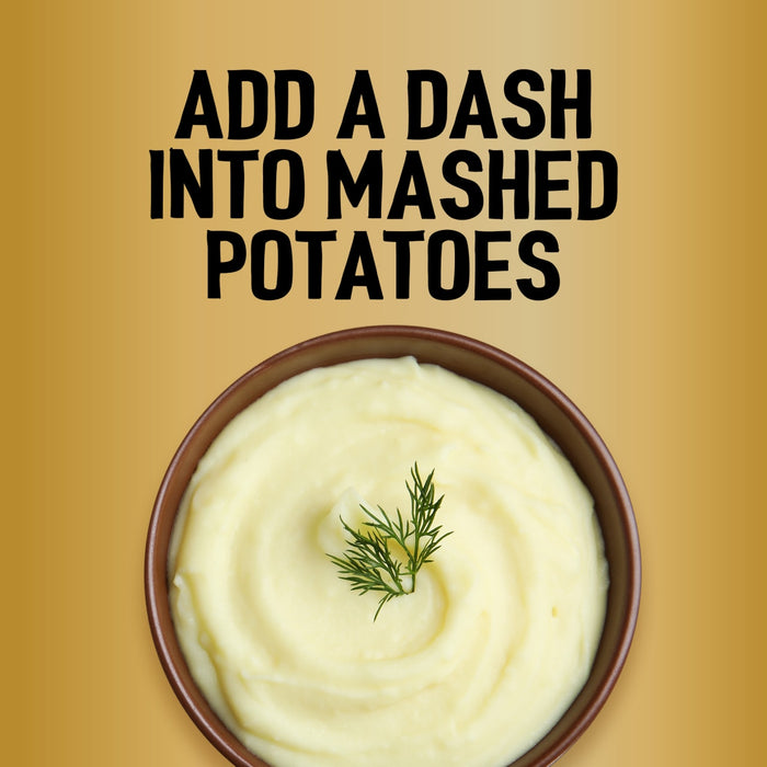 A top-down view of a bowl of creamy mashed potatoes garnished with a sprig of dill suggests that you add a dash of Jr Garlic Butter Seas X6 for extra flavor.