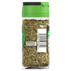 The back of a clear glass jar of Schwartz Basil 10G is shown, displaying the dried green basil flakes, barcode, and storage instructions against a white background.