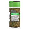 The back of a clear glass jar of Schwartz Italian Herbs, 11G, shows the product's label with ingredients and cooking suggestions against the visible blend of dried herbs inside.